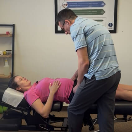 dr jeff of Back to Wellness Chiropractic adjusting pregnant woman