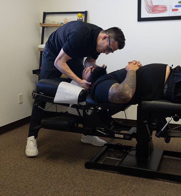 adjusting patient's neck