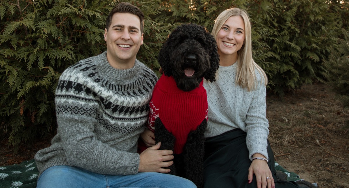 Dr. Zac Frame in nature with his dog and female companion