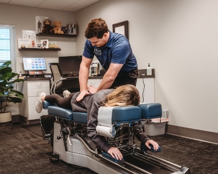 Female patient back adjustment