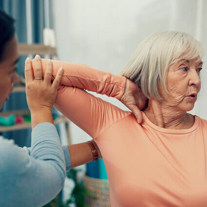 mature-woman-in-tshirt-having-elbow-examined-sq