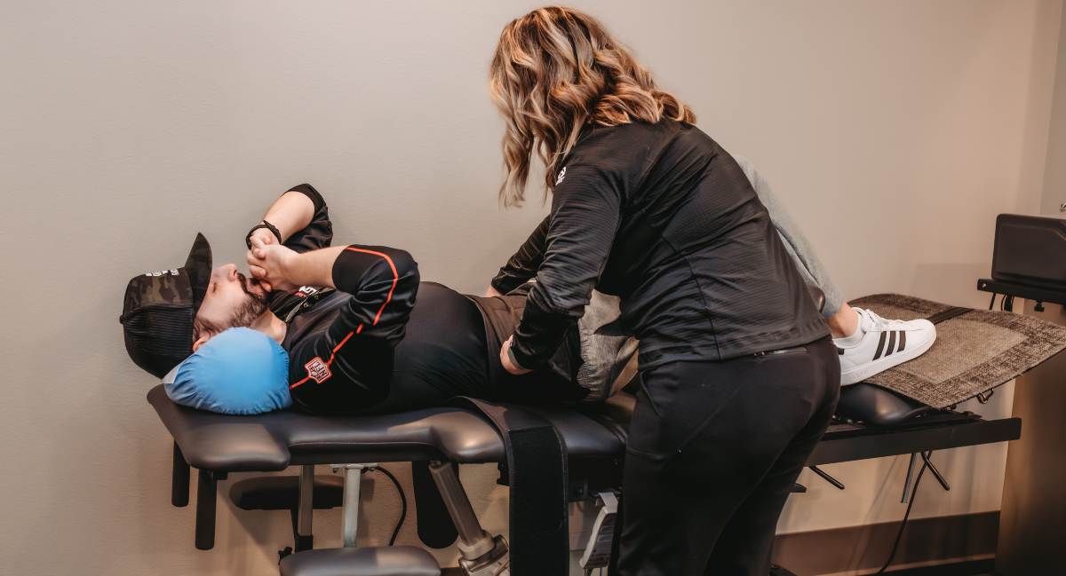 Patient getting set up on Spinal Decompression Treatment Table