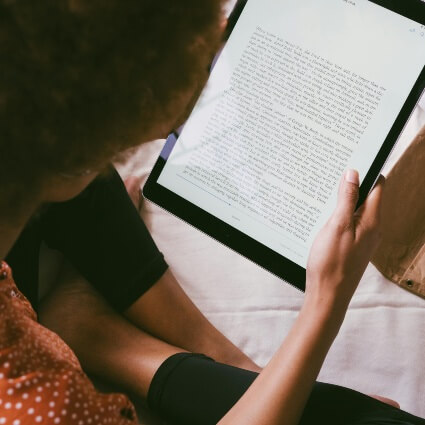 person reading on their ipad