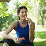 woman eating a carrot