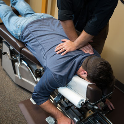 Dr. Nafziger performing an upper back adjustment