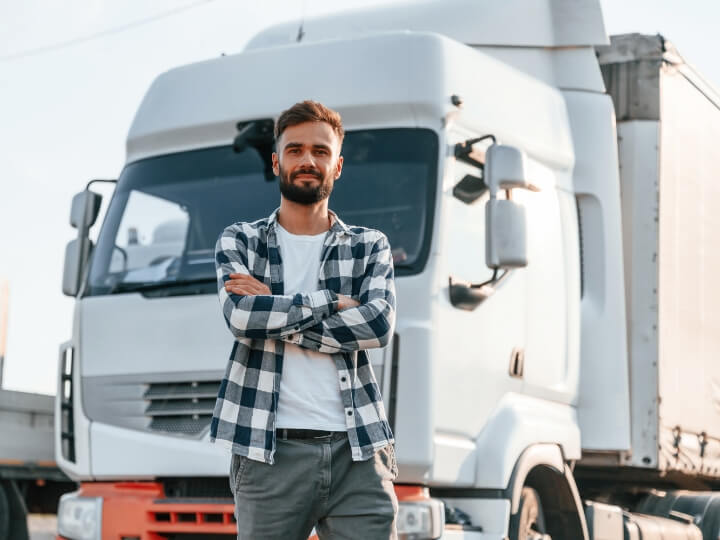 person stadning in front of truck