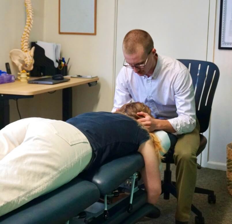 adjusting patient neck