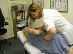Sandra Davies adjusting a patient.
