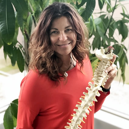 Dr Nancy holding spine model