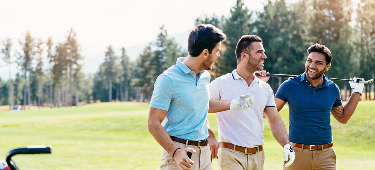 three men playing golf