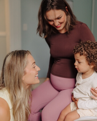 Dr. Cassie with female patient and child