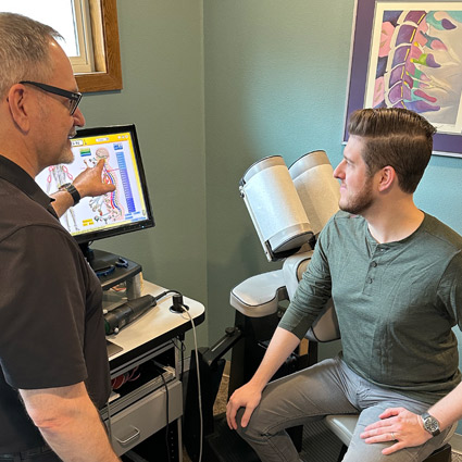 Dr. Stramara reviewing ProAdjuster imaging with his patient