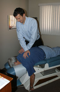 London Chiropractor adjusts patient