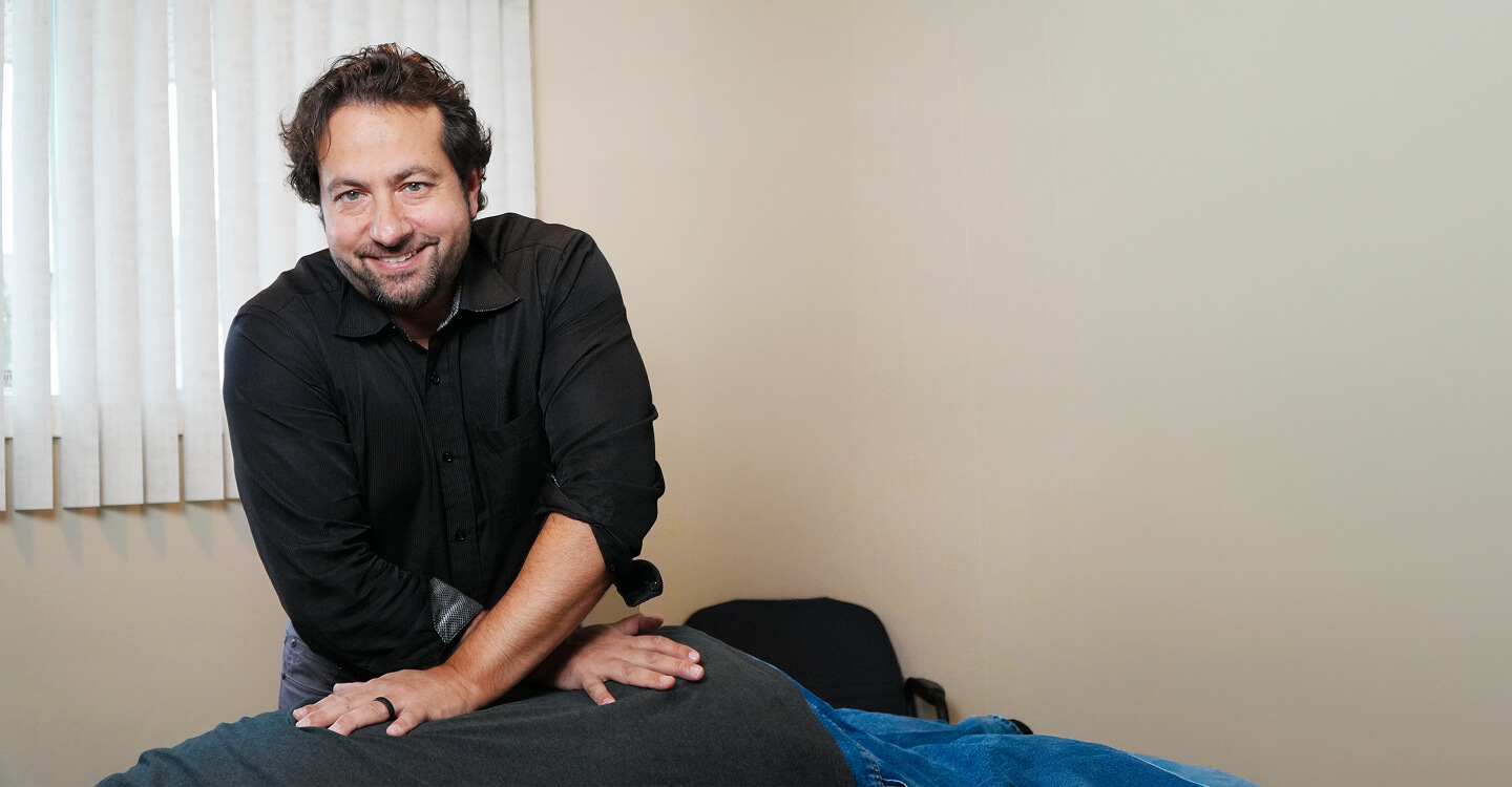 London chiropractor Dr Peter adjusting patients back