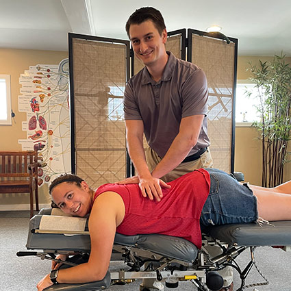 chiropractor adjusting pregnant patient