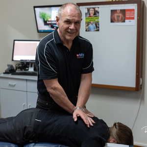 Dr Ross Funnell adjusting a patient