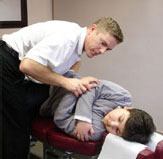 Mississauga Chiropractor of Universal Chiropractic: Adjusting a patient