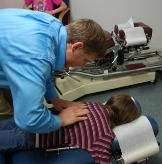 Dr. Lippert adjusting a chiropractic patient. 