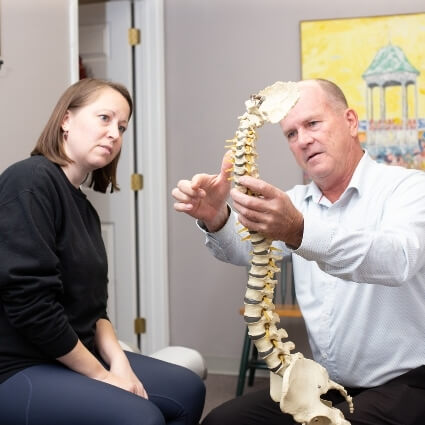 Dr Collins talking with a patient