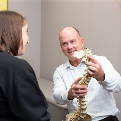 Prince Frederick chiropractor Dr Collins talking with patient