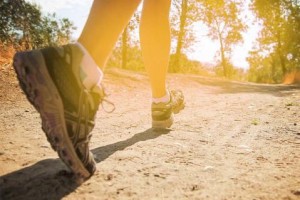 person running on a dirt trail