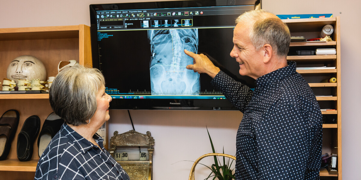 Peterborough chiropractor Dr. Jeff in discussion with patient