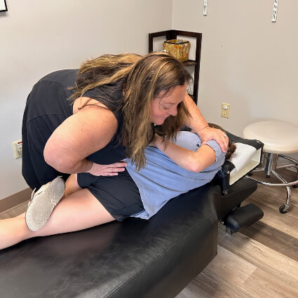 Weymouth Chiropractor Dr. Diane Capone adjusting patient