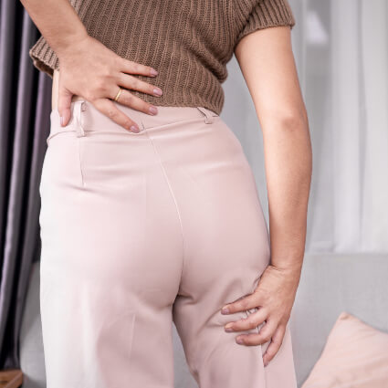 woman with lower back and leg pain