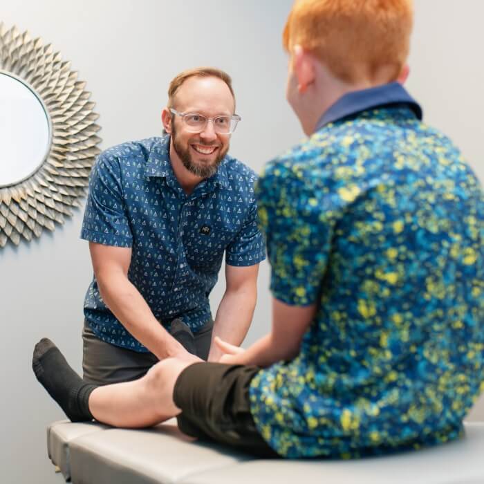 Doctor adjusting kid patient