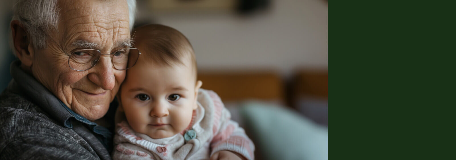 Smiling elderly man and little baby