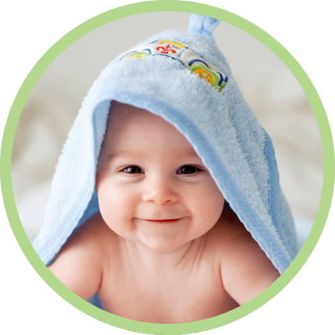 Happy baby with towel on head