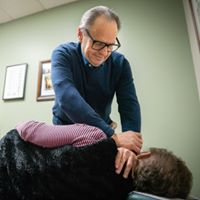 Dr. Miller adjusting a patient