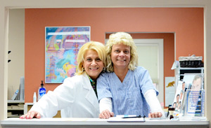 Staff smiling at front desk