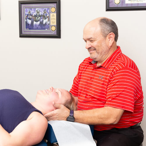 adjusting woman's neck