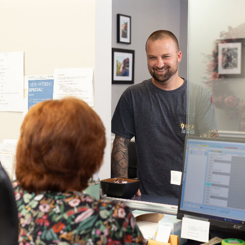 patient at reception desk