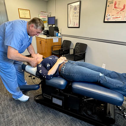 Doctor adjusting female patient