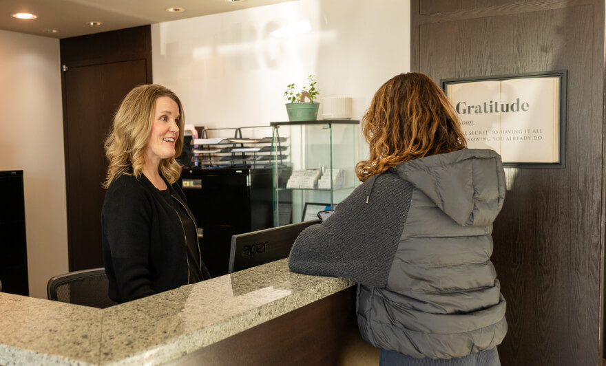 Center For Healthy Living practitioner showing patient a form