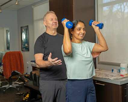 Woman raising weight