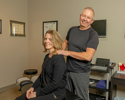 Dr Plotnikoff adjusting neck