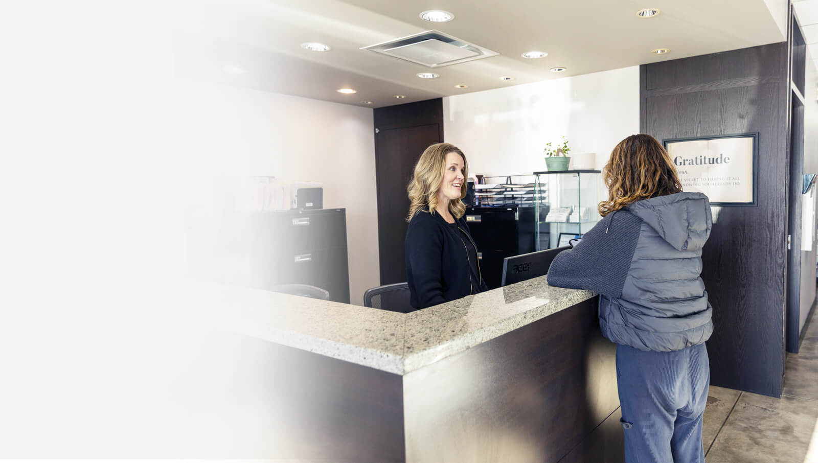 woman at reception desk
