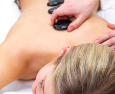 Woman getting hot stone massage