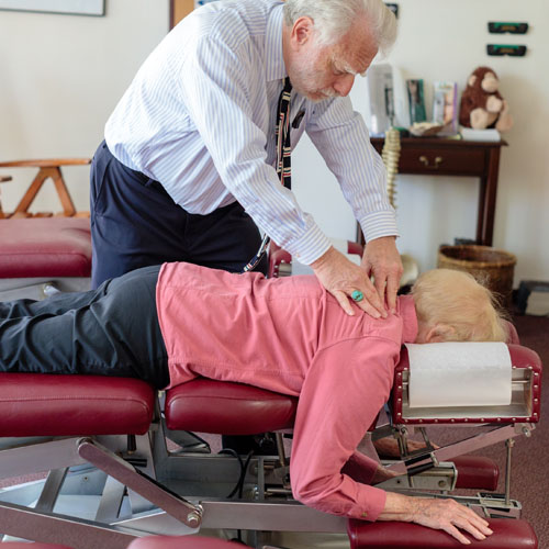 Dr Harte adjusting senior patient