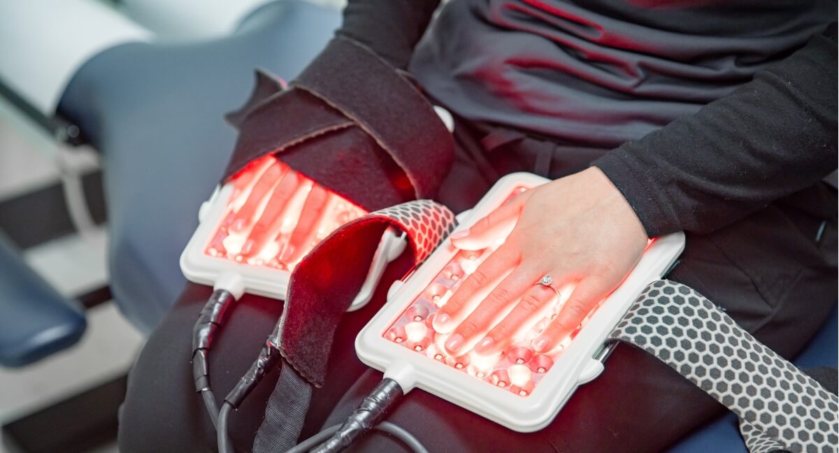Light therapy used on patient's hands