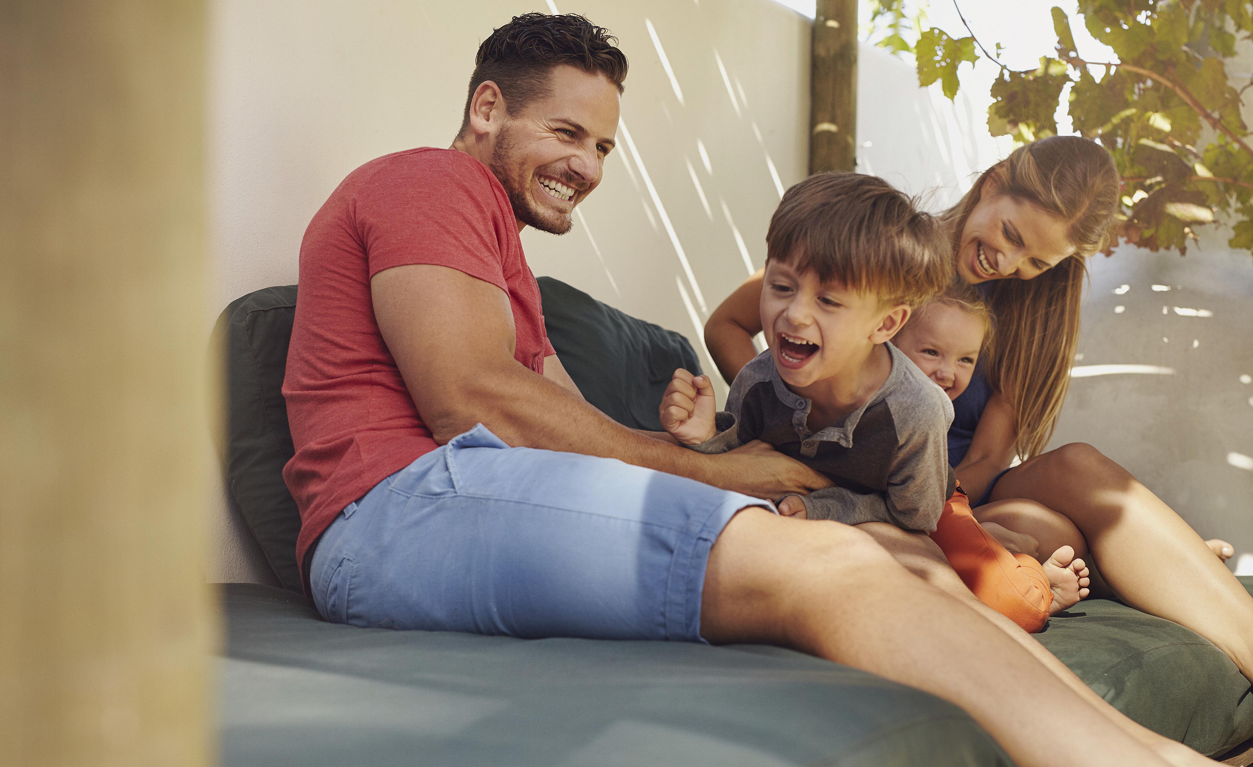 Happy family having fun together in the backyard