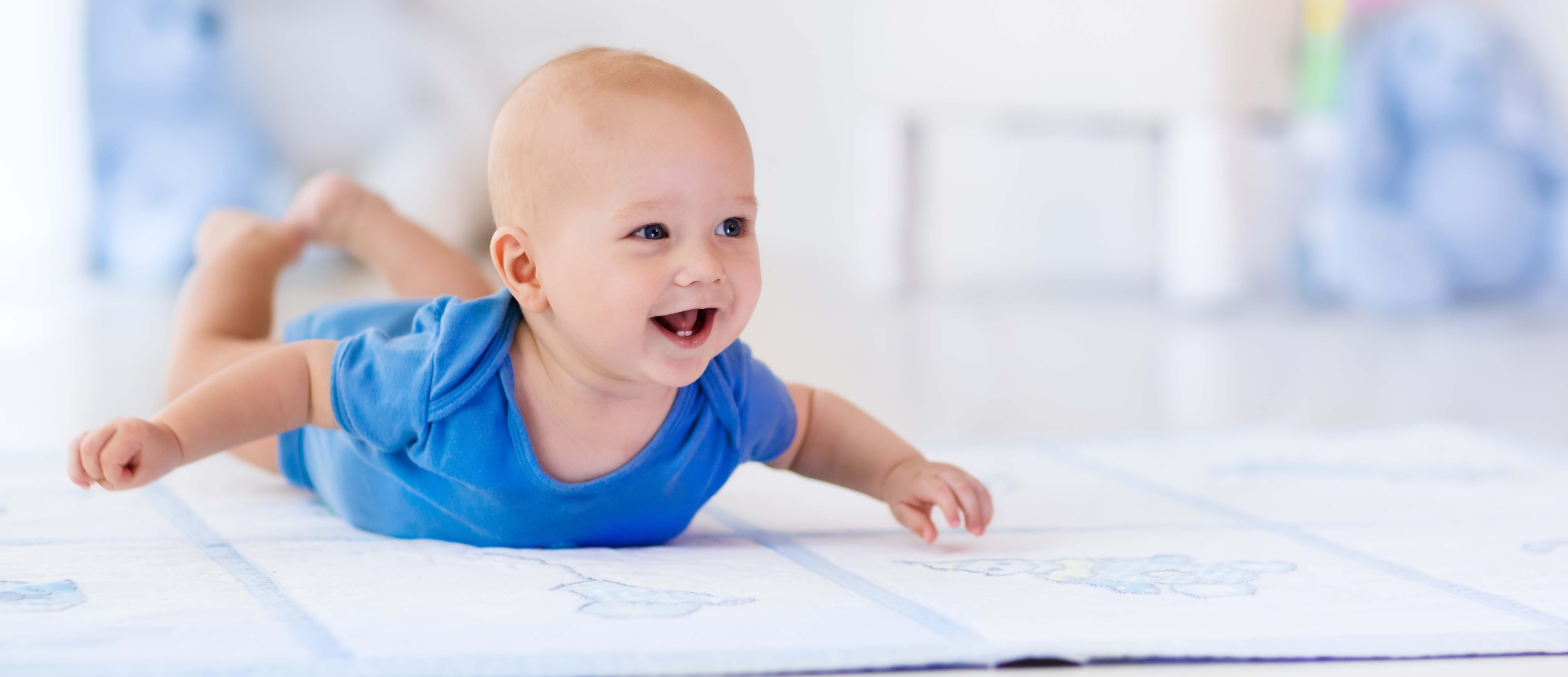 Littele baby boy in white nursery