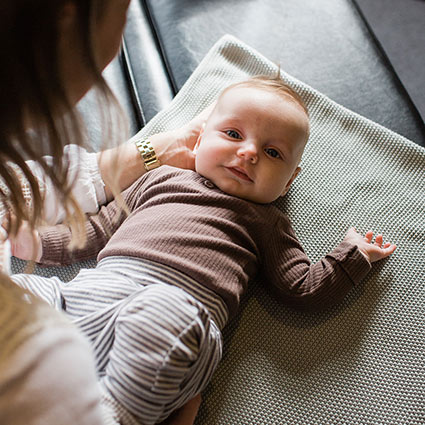 baby smiling at the camera