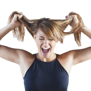 woman pulling her hair in frustration