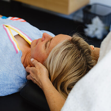 patient having neck adjusted