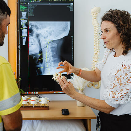 Dcotor reviewing xrays with patient