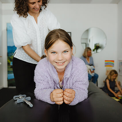 Young girl getting chiropractic treatment